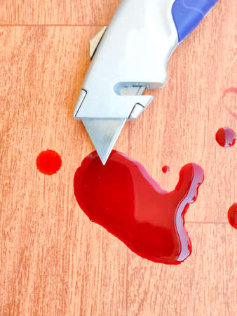box cutter with bloody blade.の写真素材