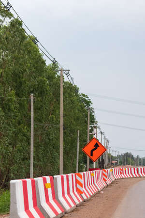 Traffic signs warn to turn right while working.の写真素材