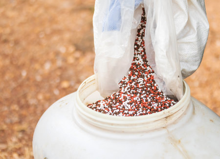 Chemical fertilizers are sprayed in the tanks to prepare them to be put in the farmer's fields. Currently, chemical fertilizers are very expensive.の写真素材