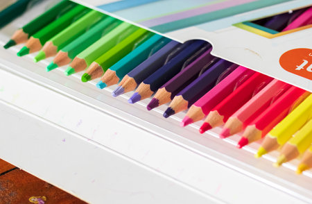 Multi-colored Pencils in Box on White Backgroundの写真素材