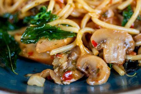 Spaghetti with Spicy Mixed mushroom and basil.Thai fusion food. Healthy foodの写真素材