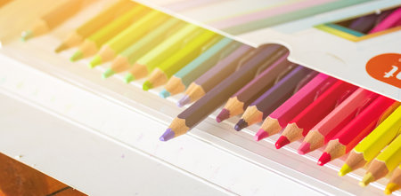 Multi-colored Pencils in Box on White Backgroundの写真素材