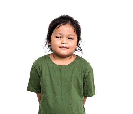 Smiling little girl wearing green shirtの写真素材