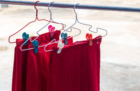 red school skirt Hang it on the clothesline.の写真素材