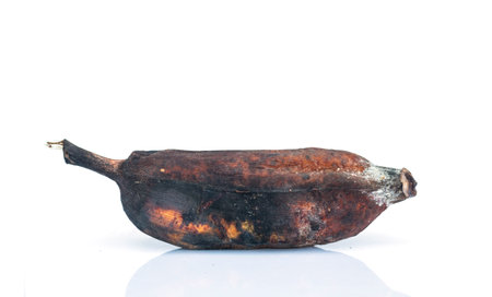 Rotten banana on a white background. Selective focus. Close up.の写真素材