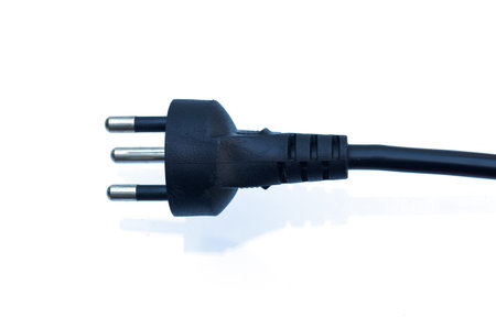 Black electrical connector plug with cord on a white background.の写真素材