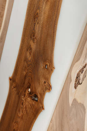 Exclusive handmade table of solid wood and epoxy resin on the background of wood boardsの写真素材