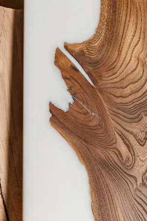 Exclusive handmade table of solid wood and epoxy resin on the background of wood boardsの写真素材