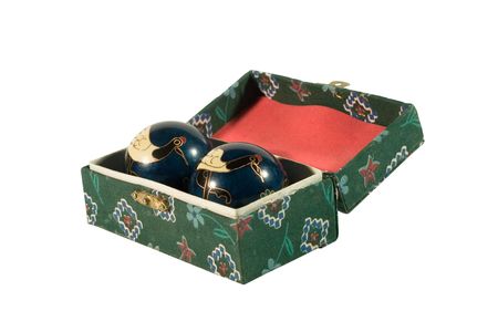 Box with antique Chinese relaxation balls (isolated on white)の写真素材