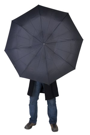 Man hiding behind a black umbrella (isolated on white)の写真素材