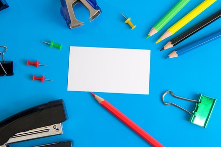 White paper card for your text and stationery (on a blue background)