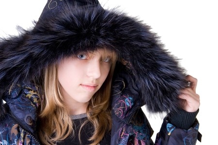 Beautiful blonde girl wearing a jacket with fur (isolated on white)の写真素材