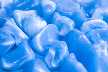Slightly blurred bright blue pebbles as an abstract backgroundの写真素材
