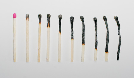 Row of new and burnt matches