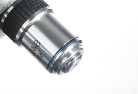 Microscope objective isolated on white