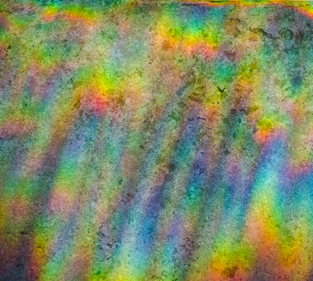 Beautiful abstract multicolored rainbow background (refraction of sun light on a stone background)の写真素材