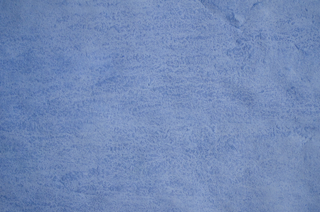 Crumpled blue paper (as a paper background or abstract blue background)の写真素材