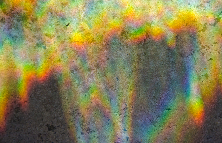 Abstract multicolored rainbow background (refraction of sun light on a stone background)の写真素材