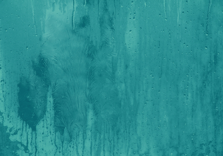 Frost pattern on the window glass (as an abstract New Year or winter background)の写真素材
