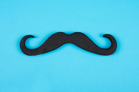 Black moustache on a blue backgroundの写真素材