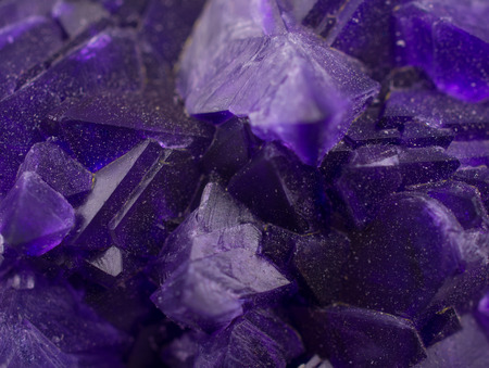 Macro shot of a magic purple crystal as an abstract backgroundの写真素材