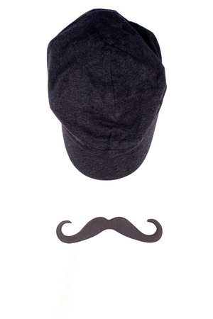 Cap and black moustache (isolated on white, top view)の写真素材