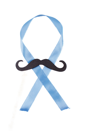 Black moustache and a blue ribbon as a symbol of the anti-cancer campaign (isolated on white)の写真素材