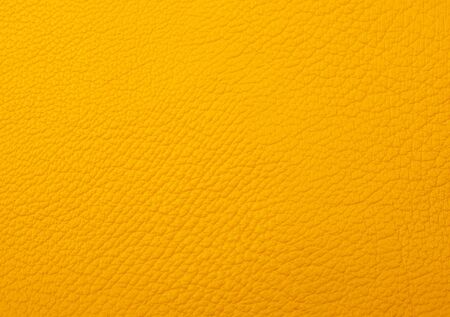 Bright yellow leather as a leather texture or an abstract yellow backgroundの写真素材