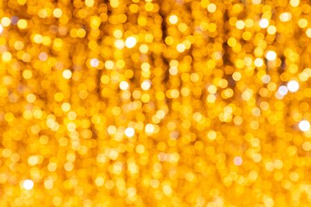 Bright golden soft focus background (as a beautiful festive background)の写真素材