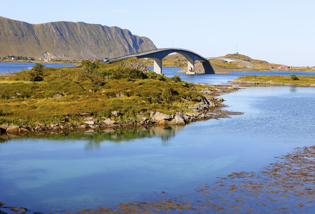 famous fredvang bridges in autumn with mountains in backgrond and beautiful blue fjord in foreground , lofoten islands, norwayの写真素材