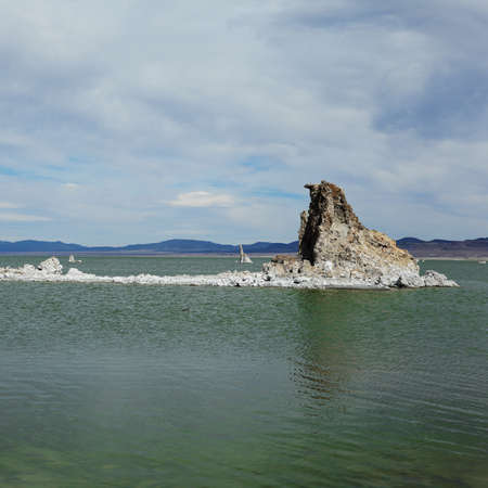 Mono Lake Tufa State Natural Reserve, California. Spectacular view of green water with single rock.の写真素材