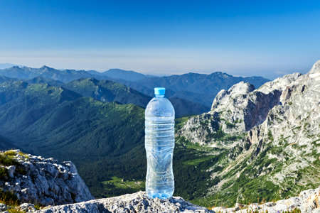 a water bottle on the top of a mountainの写真素材