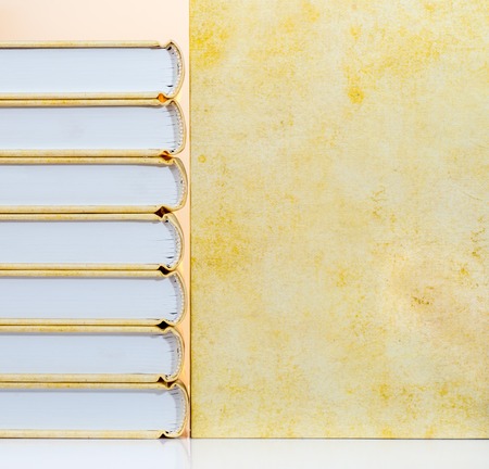 stack of books with a yellow backgroundの写真素材