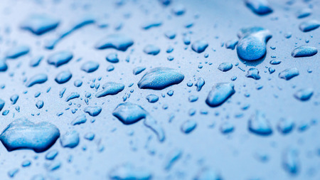 drops of water on the car after rainの写真素材