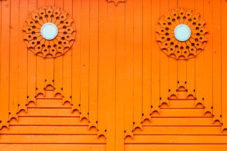 orange wooden house with patterns of of boards. Vintage backgroundの写真素材