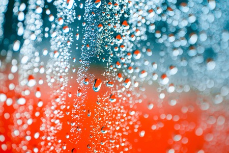 Water drop on orange backgroundの写真素材