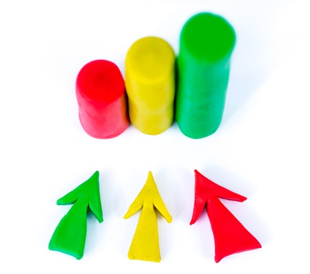 Bar chart and arrow made out of colorful play dough. Red, green, yellow. Icon on white background.