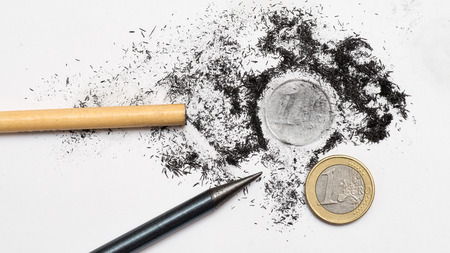 One Euro coin drawing and pencil on white backgroundの写真素材