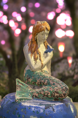 Famous Little Mermaid inspired by Hans Christian Andersen's book under the cherry blossoms of Asukayama Park in the night of Kita district, north of Tokyo.のeditorial素材