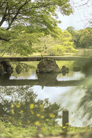 japanese Togetsu Stone bridge on the pond of Rikugien Park in Bunkyo district, north of Tokyo. The park was created at the beginning of the 18th century.の写真素材
