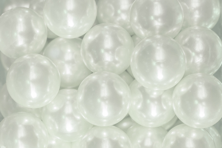 Cutout texture closeup on multiple white shiny pearls.の写真素材