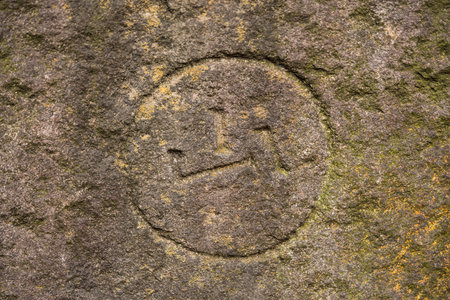 Kanji meaning mountain on one of the wall stones of Koishikawa Korakuen Park in Tokyo.のeditorial素材