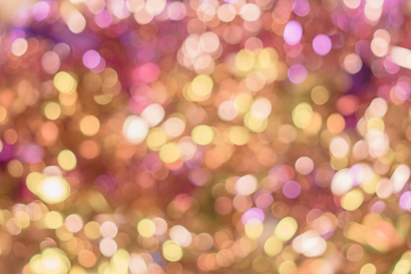 Background texture full of golden and pink shining bokeh.の写真素材