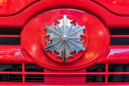 Rear view of a red Japanese fire truck with its silver head mark star in front.