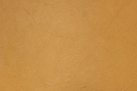 Background texture of yellow stucco wall.の写真素材
