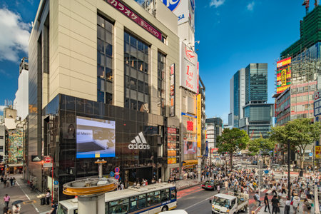TOKYO, JAPAN - AUGUST 21, 2018: Shibuya Crossing Intersection In Shibuya Station On A Bright Sky Blue Day.のeditorial素材