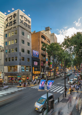 TOKYO, JAPAN - AUGUST 21 2018: Dogenzaka shopping street leading to Shibuya Crossing Intersection Shibuya station on a bright blue sky.のeditorial素材
