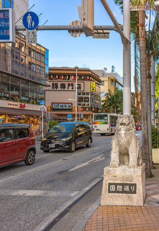 American Village, Japan - September 17, 2018: kokusai dori street which means international street decorated with two shisa lion sculptures in the city of Naha in Okinawaのeditorial素材