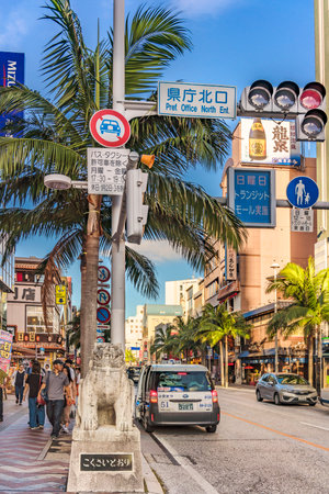 American Village, Japan - September 17, 2018: kokusai dori street which means international street decorated with two shisa lion sculptures in the city of Naha in Okinawaのeditorial素材