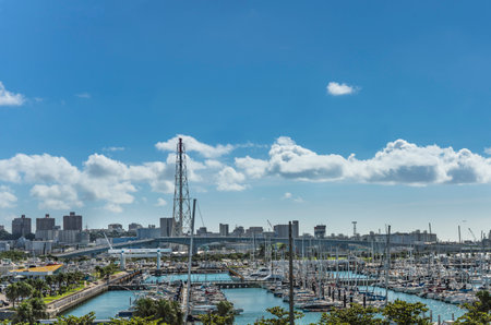 GINOWAN, JAPAN - September 16 2018: Leisure boats in the Ginowan harbor marina seen from Okinawa conversion centerのeditorial素材